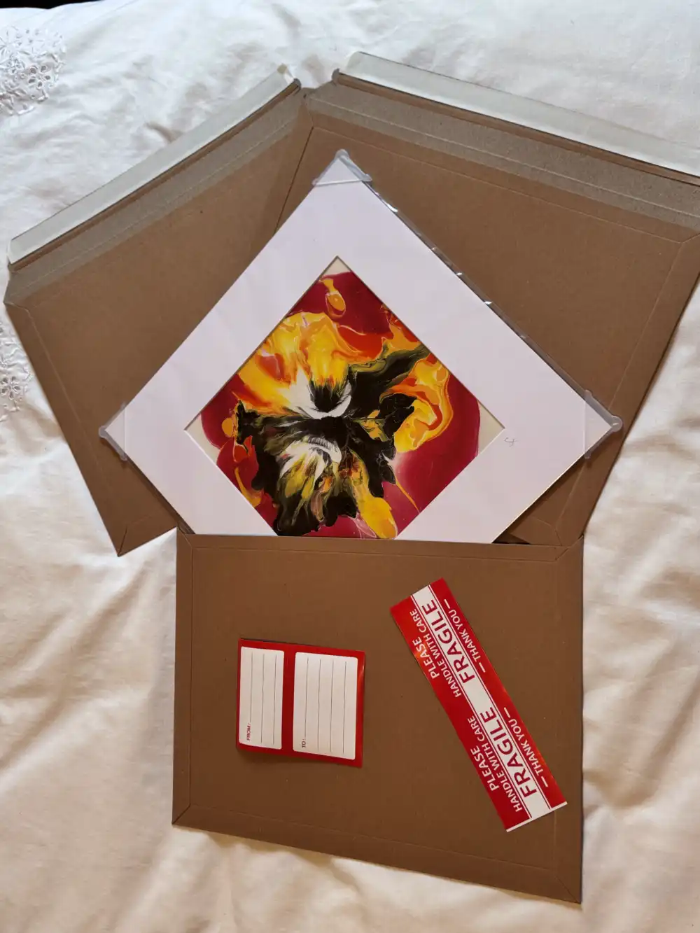 Mounted print packaged in a bespoke protective sleeve